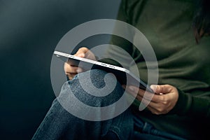 Close up of woman using digital tablet