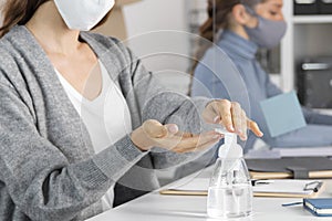close up woman using disinfectant. High quality photo
