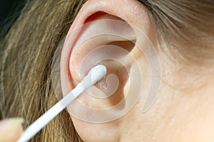 Close up, Woman using Ear cotton swabs. Hygienic ears sticks