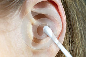 Close up, Woman using Ear cotton swabs. Hygienic ears sticks