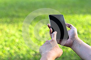 Close up of a woman using mobile smart phone with touch screen display .