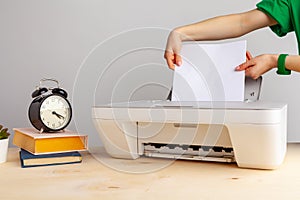 Close up of woman using a printer machine