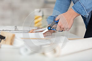 close up woman using scissors