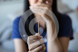 Close up of woman using toothpick