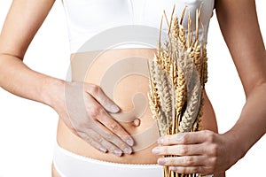 Close Up Of Woman Wearing Underwear Holding Bundle Of Wheat And