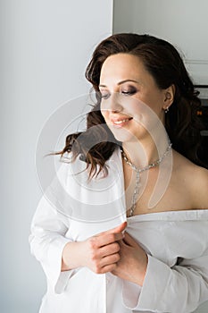 Close-up woman wears massive chain on neck, metal necklace. Modern jewellery concept