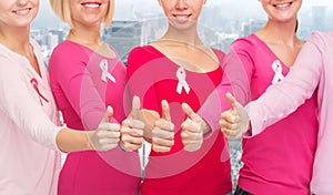 Close up of women with cancer awareness ribbons