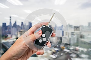 Close up women hold modern car remote control