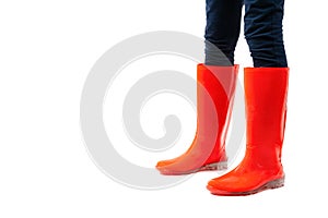 Close up of women legs in red rubber shoes isolated on white background. Rainy season weather forecast