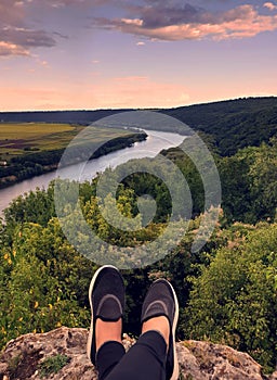 Close up of women`s foots on panoramic view on river Dniester in the Soroca town on summer, Moldova, the north-eastern part of th photo