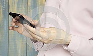 Close up of women`s hands holding cell telephone