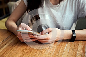 Close up women`s hands holding smart phone