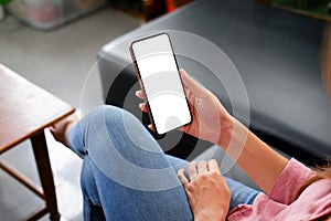 Close-up women use smart phone  white screen on sofa in hre home photo