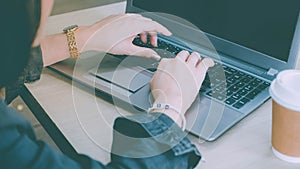 Close-up of women using computers, notebooks, typing messages, communicating online business with the service providers on the