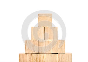 Close up at wood cube arrange in pyramid shape ,business concpt