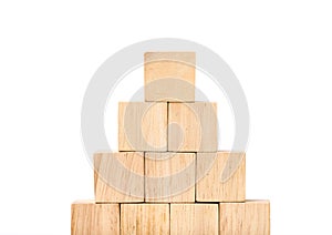Close up at wood cube arrange in pyramid shape ,business concpt photo