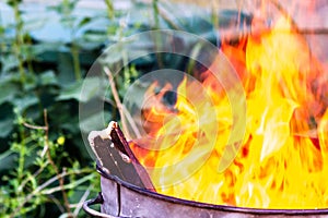 Close up of wood in a garden incinerator fire