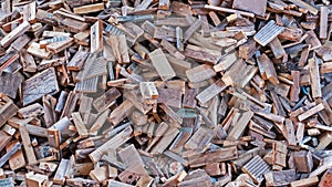 Close up wood piled high prior to use as fuel