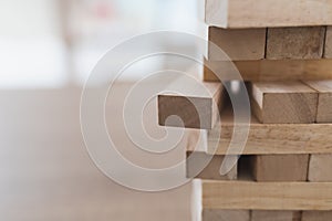 Close up of wooden blocks tower Jenga and copy space