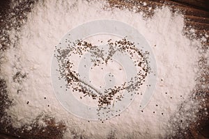 Close up of wooden board with flour as a background