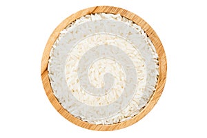 Close up wooden bowl of jasmine rice grain