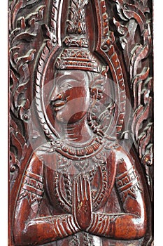 Close-up wooden brown male Thai angel statue filled isolated with white backgrounds, wooden crafting product painted with dark bro