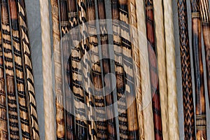 Close up of wooden canes decorated with several designs