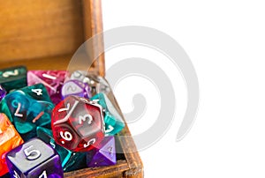 Close up of wooden chest full of dice