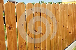 Wooden Fence Door. Cozy Wood Fence - Wood Fencing. photo