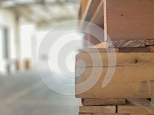 Close up of wooden pallet stack and blurred background with copy space