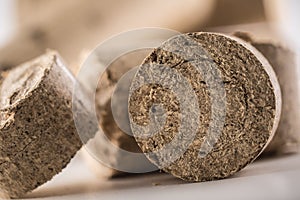 Close-up wooden pressed briquettes from biomass