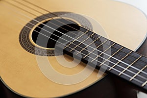 Close-up Wooden Spanish classic guitar with nylon string select focus shallow depth of field