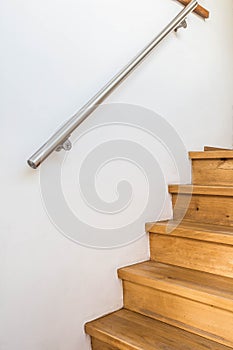 Close up of wooden stairs and railing in a home, details of a modern house