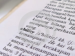 a close up of the word ability in the English to Indonesian dictionary. For language background or wallpaper