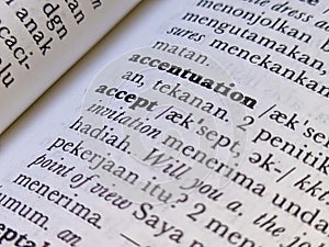 a close up of the word accept in the English to Indonesian dictionary. For language background or wallpaper