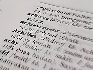 a close up of the word achievement in the English to Indonesian dictionary