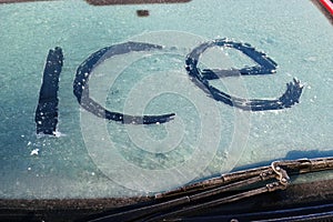 Close up of the word ice on windscreen.