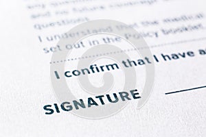 Close up word signature on business agreement form