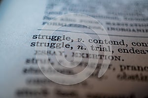 Close up of word struggle in dictionary
