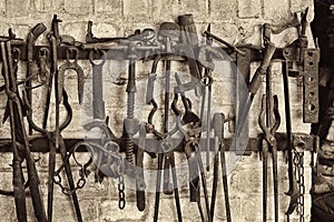 Close-up of work tools hanging at blacksmith shop