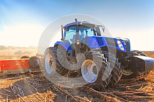 Close-up work of a tractor on a wheat field