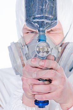 Close-up of worker with airbrush gun