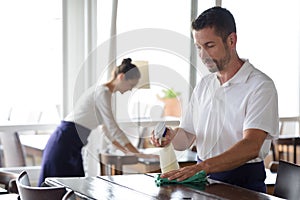 close up worker in restaurant cleaning