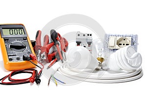 Close-up of working tools and components of the electrical system on white background.