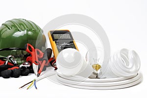 Close-up of working tools and components of the electrical system on white background.
