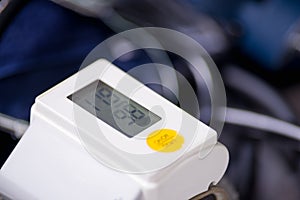 Close up of wrist blood pressure monitor showing normal blood pressure, medical concept