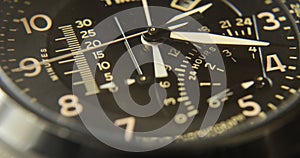 Close up wrist watch, chronograph, chronometer, analog, close up hour and minute hand, black background, close up watch