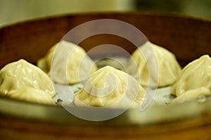 Close-up of the Xiao Long Bao or soup dumpling in bamboo steamers.