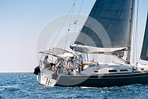 Close-up of a yacht with crew in open sea