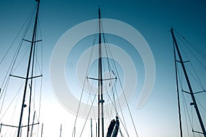 Close-up of yacht masts against the blue sky. Marine theme